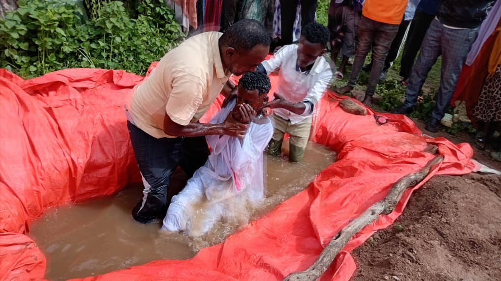 Baptism in a hand-dug pool in Ethiopia